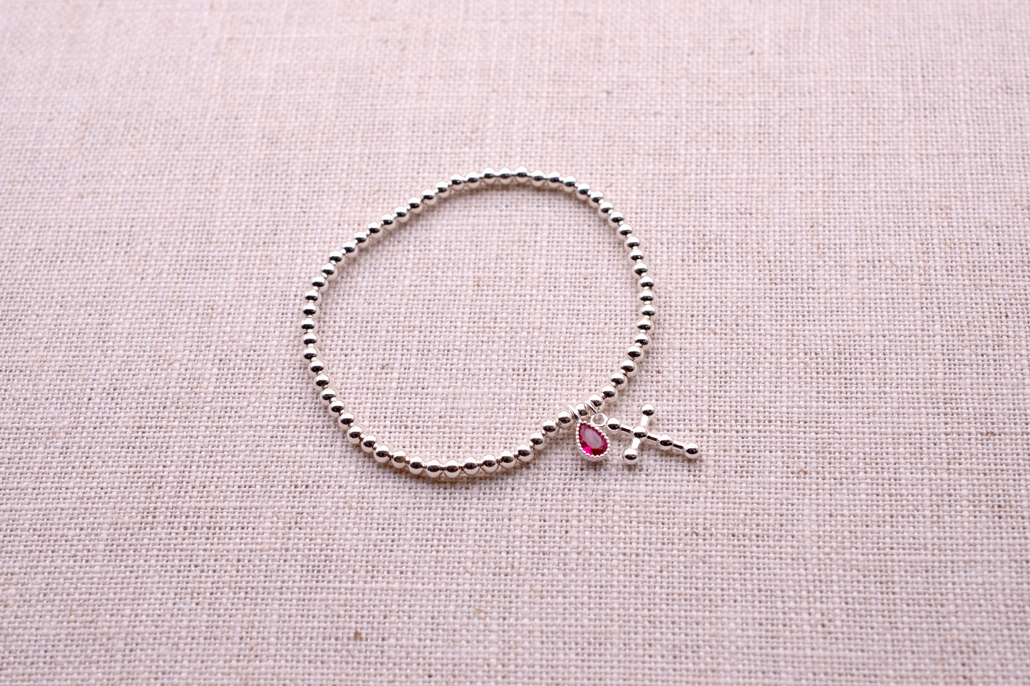Sterling Silver Base: Pink Drop Tennis Bracelet