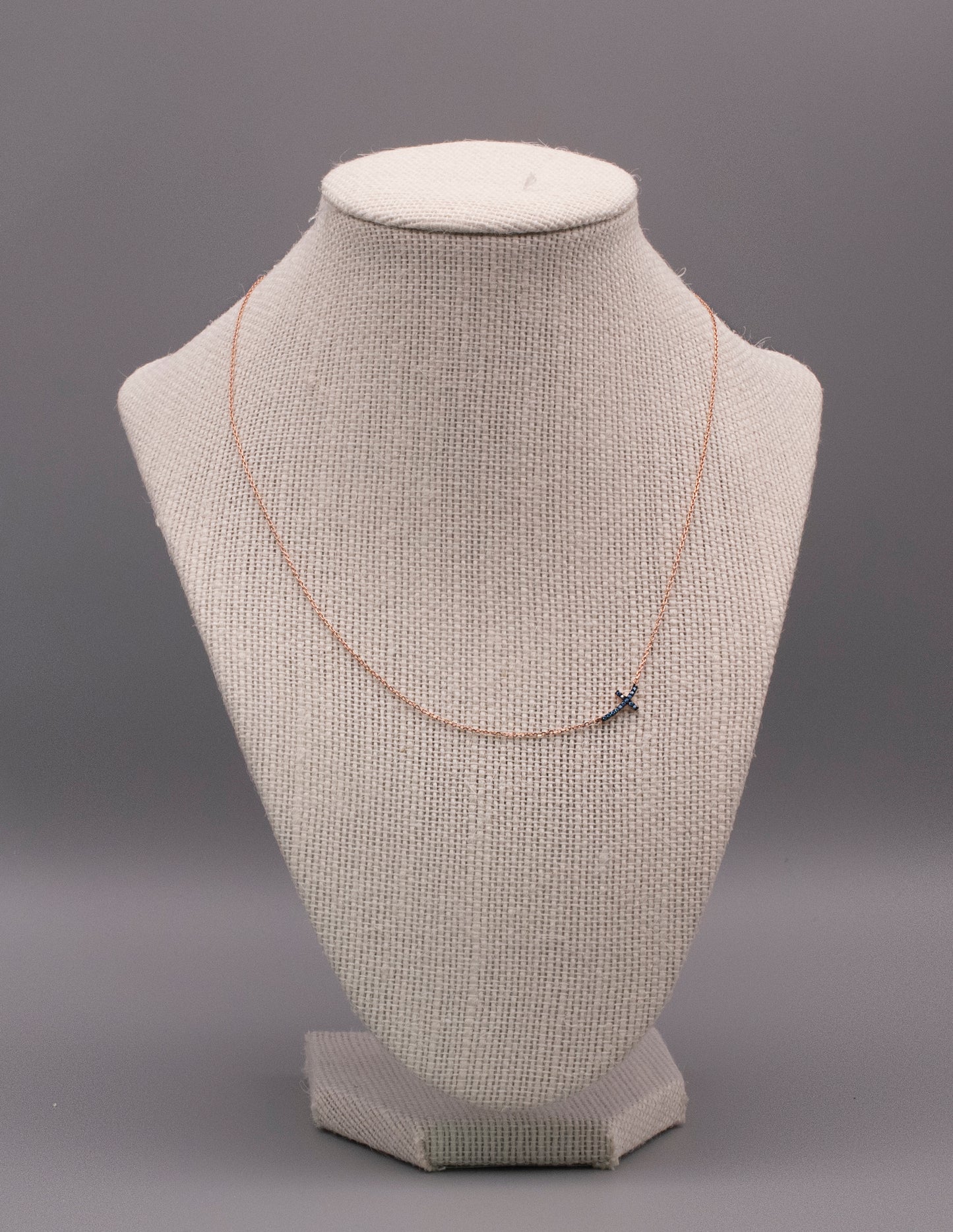 Sterling Silver Base: Blue Curved Cross Necklace