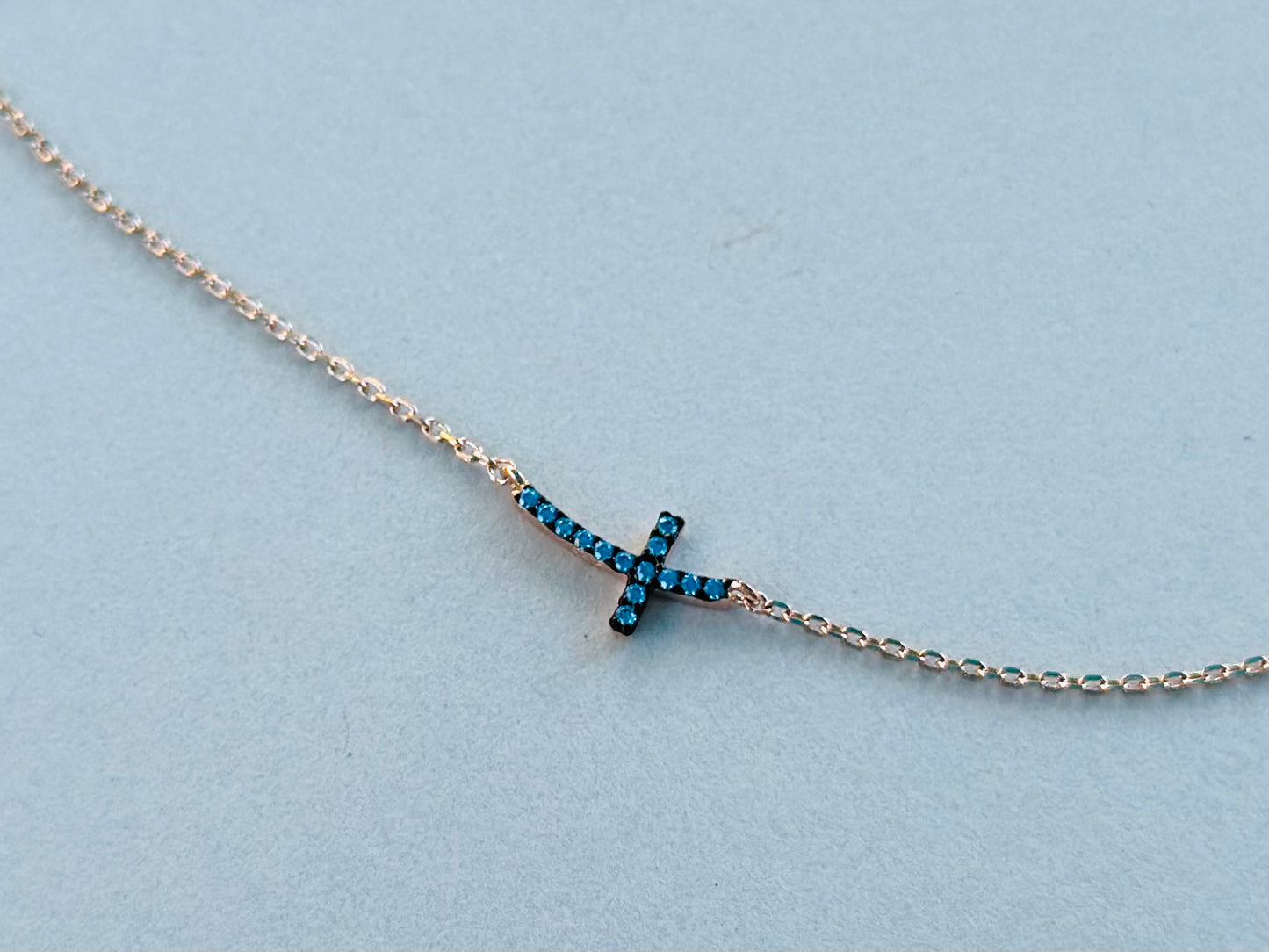 Sterling Silver Base: Blue Curved Cross Necklace