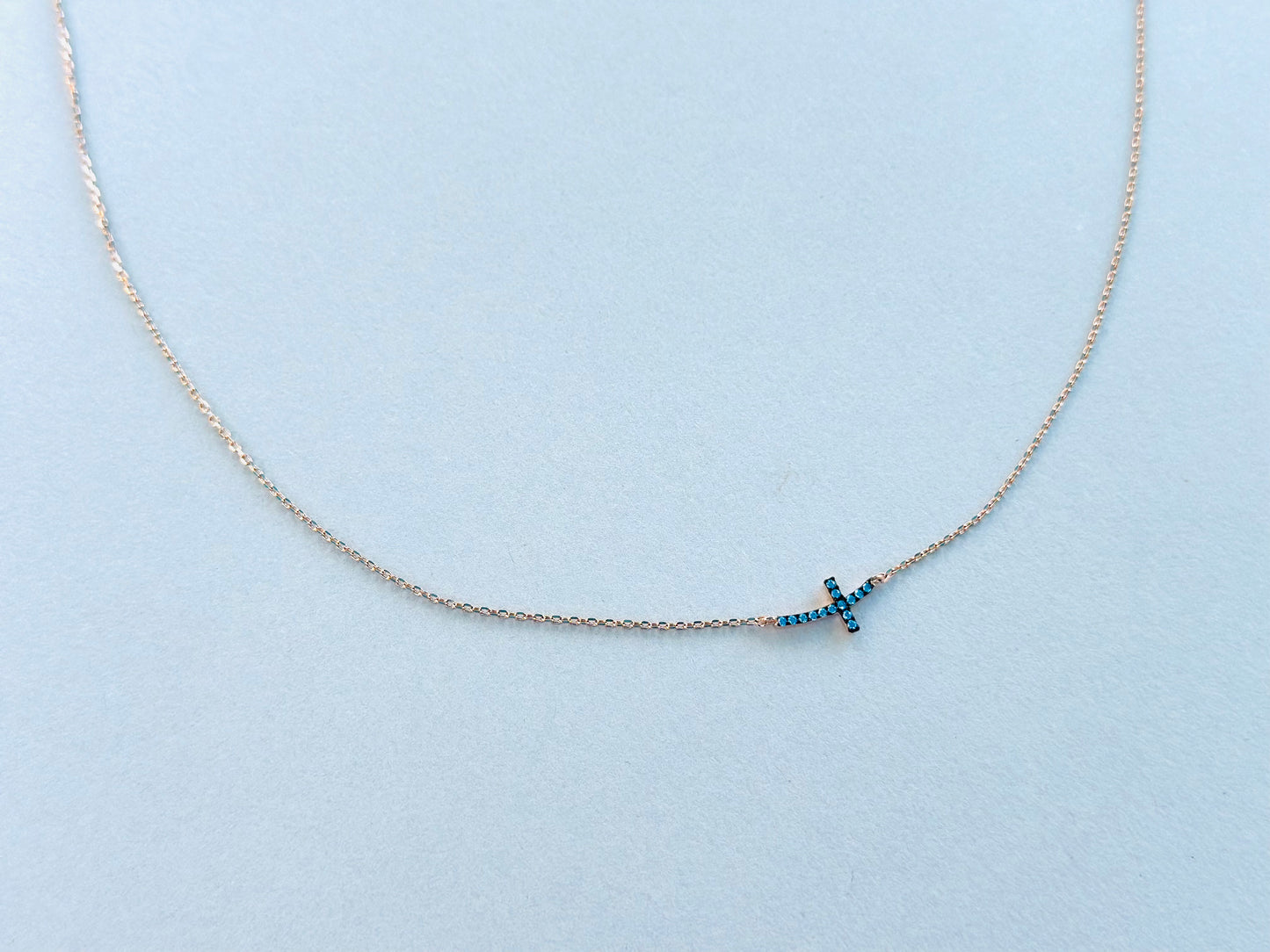 Sterling Silver Base: Blue Curved Cross Necklace