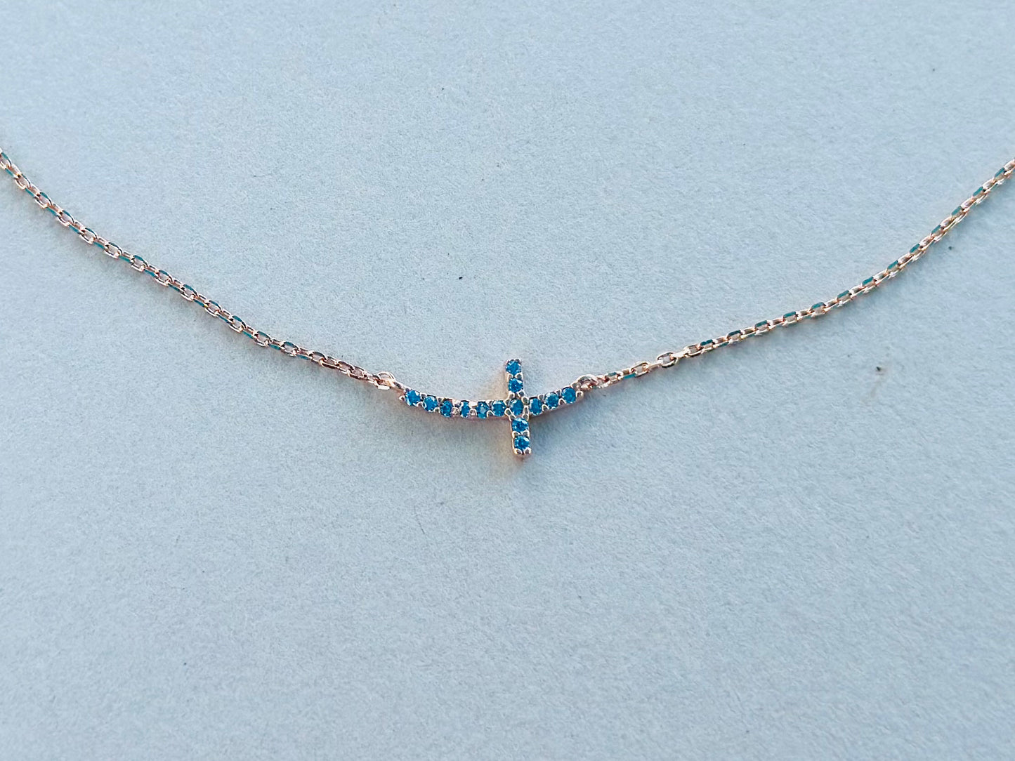 Sterling Silver Base: Blue Curved Cross Necklace