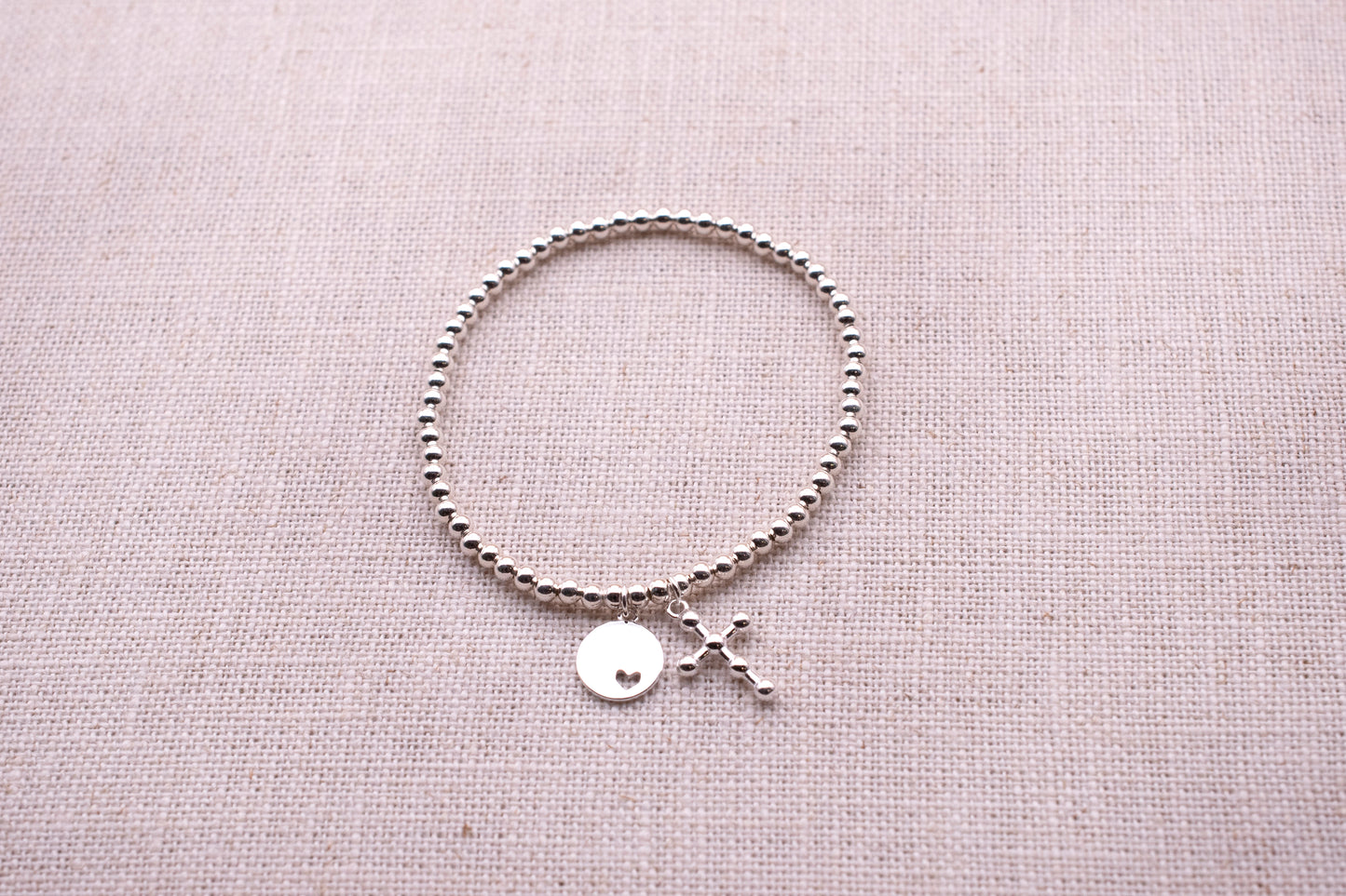 Sterling Silver Base: Petite Heart Disc Cross Bracelet